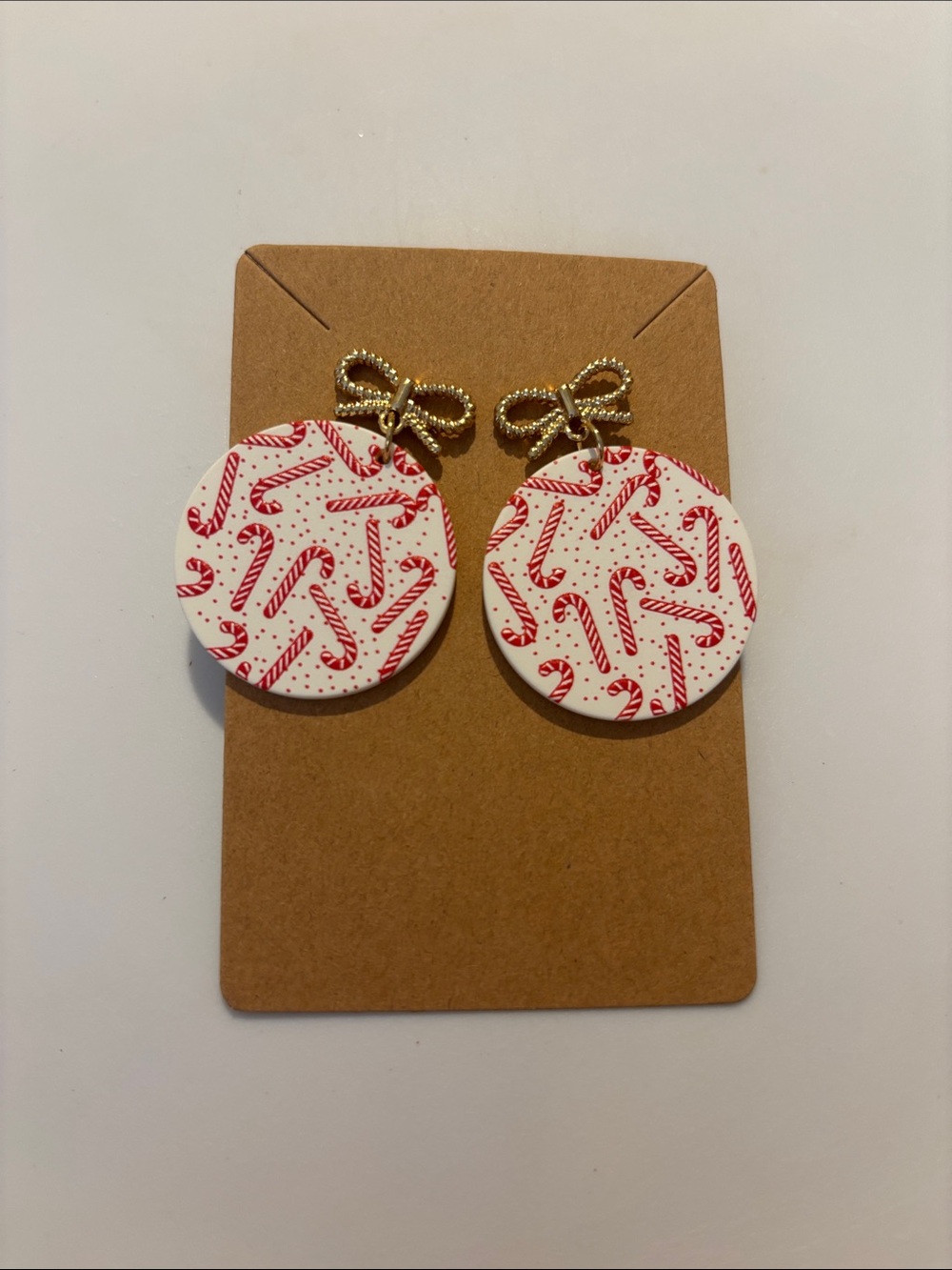 Fashion Jewelry Gold Bow Drop Earrings with White & Red Candy Cane Discs